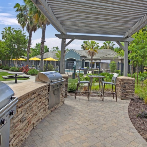 a grill area with chairs